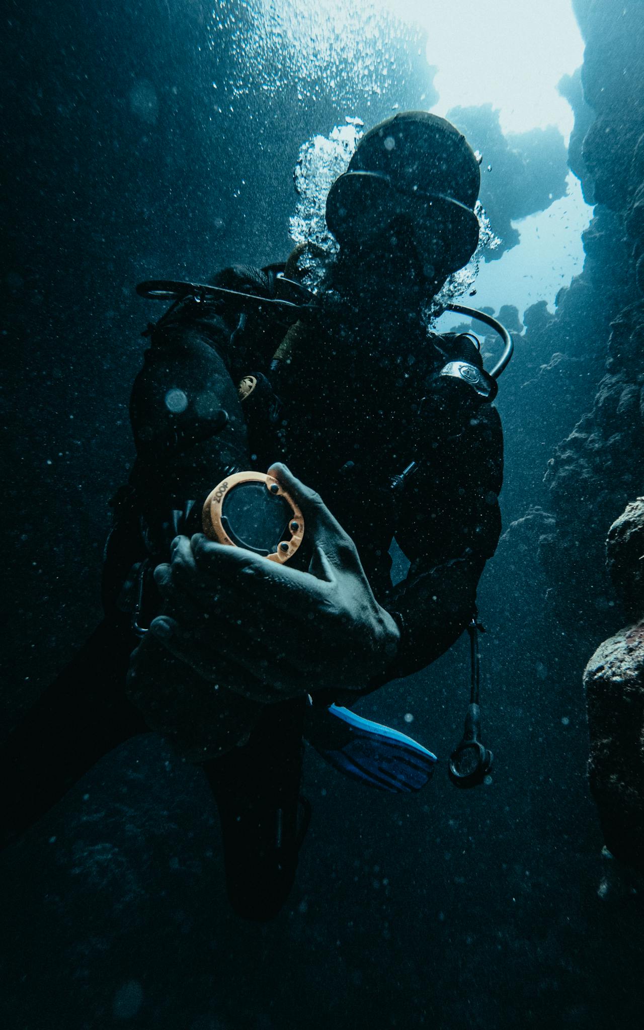 A scuba diver exploring underwater caves in Dahab, Egypt, capturing the adventurous underwater world.